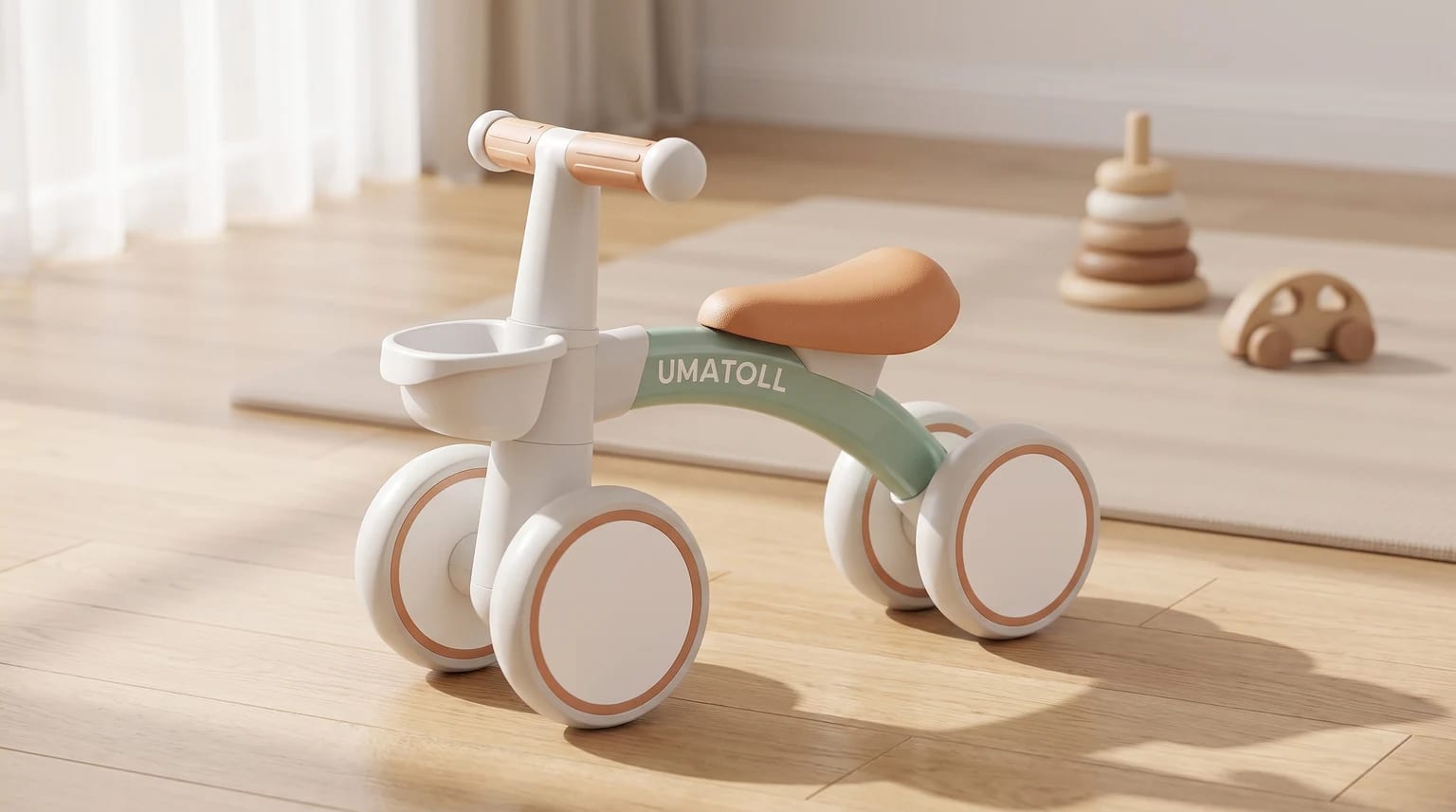 A white and mint green Umatoll baby balance bike with a tan-coloured seat and handlebars, sitting on a light wood floor.